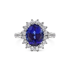 Tanzanite Oval & Brilliant Cut Diamond Cluster Ring With Grain Set Shoulders