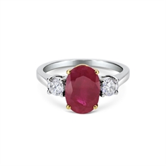 Oval Ruby & Brilliant Cut Diamond Claw Set Three Stone