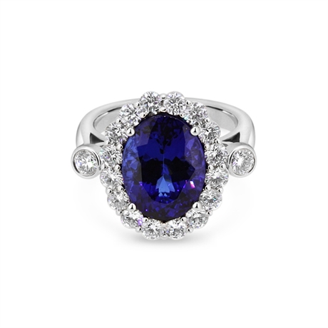 Oval Tanzanite & Brilliant Cut Diamond Cluster Ring With Rub-over Shoulders